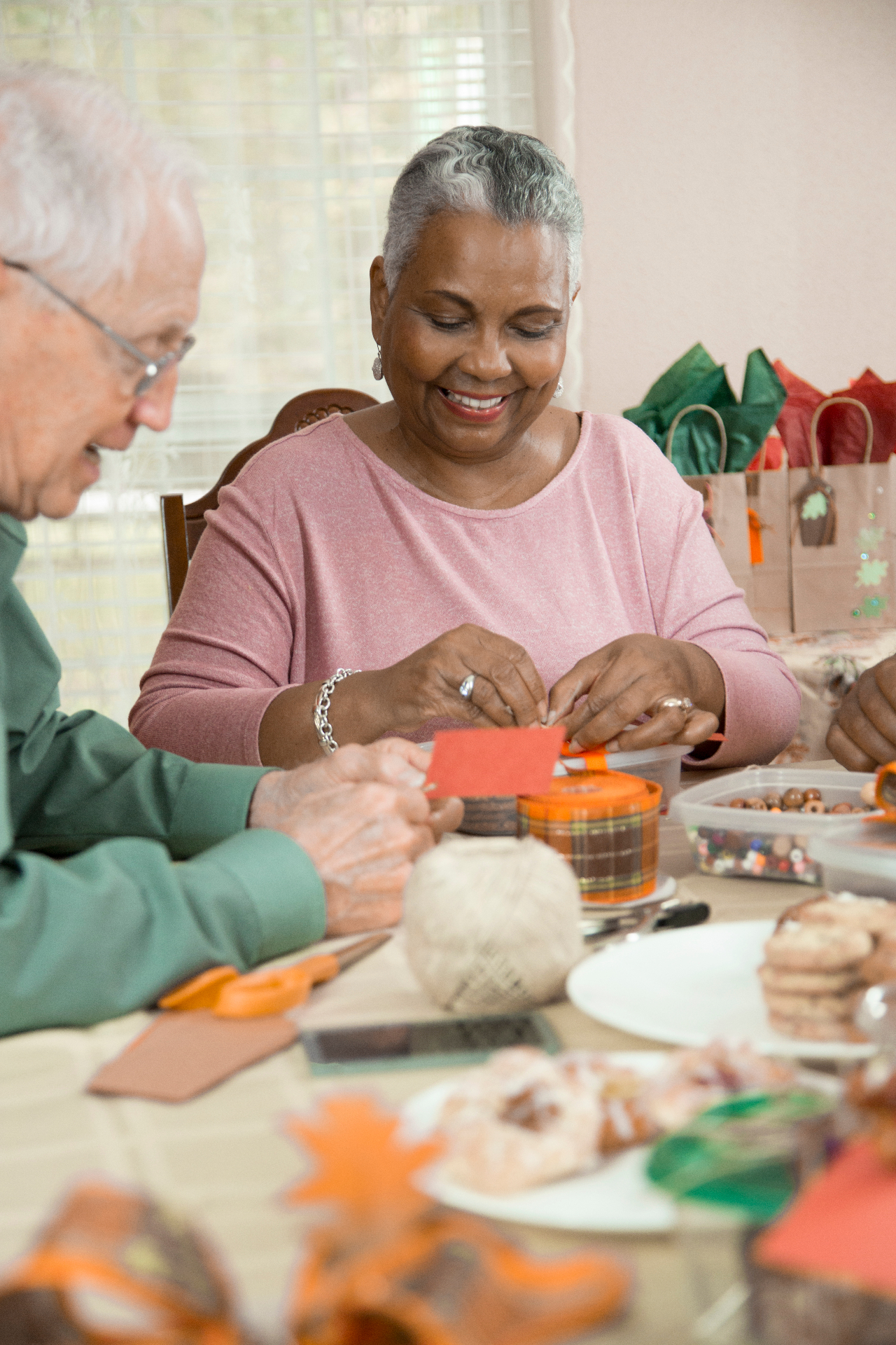 Seniors enjoying a crafting activity together at Wavecrest